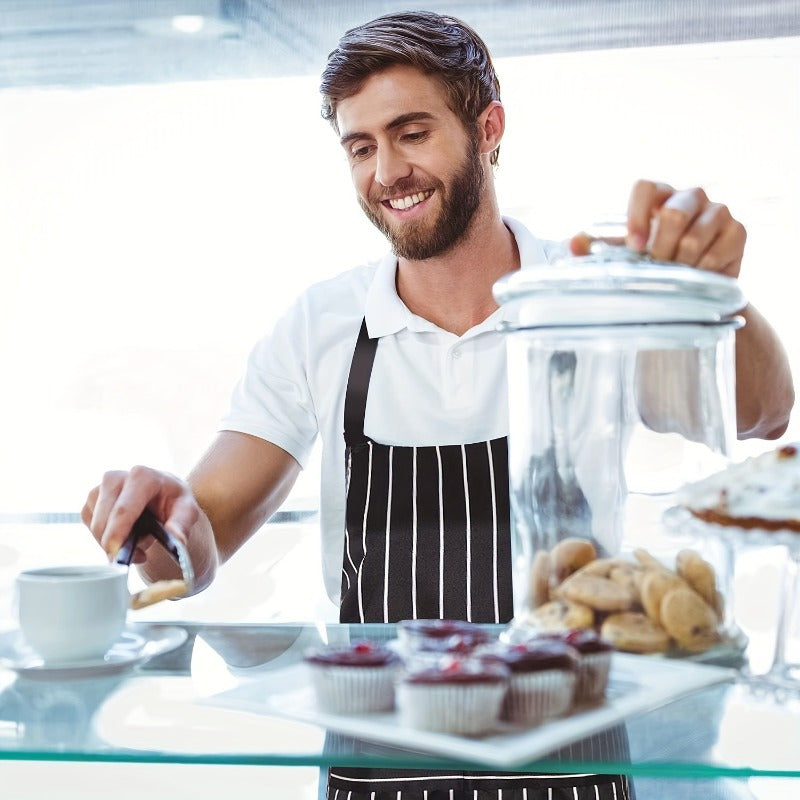 One or two adjustable aprons in a stylish black and white striped design, featuring a convenient pocket for both women and men in the home kitchen. Perfect for cooking, these chef aprons are essential kitchen supplies.