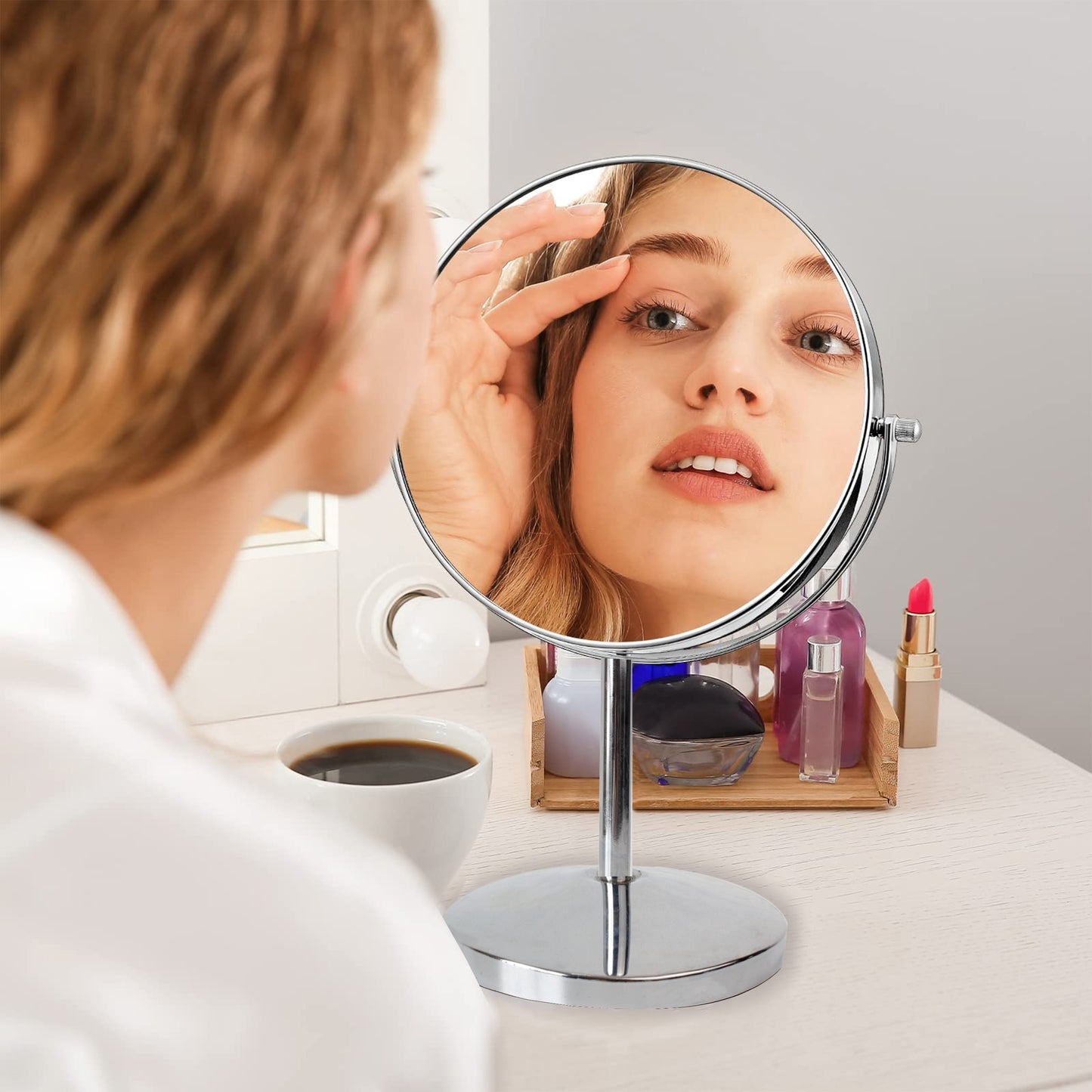 Double-sided magnifying makeup mirror with 10X/1X magnification. Rotate 360 degrees for use in desktop, bathroom, and office.