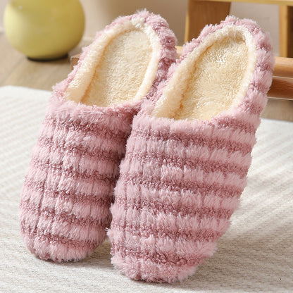 Women's striped print plush house slippers with anti-slip sole for indoor use.