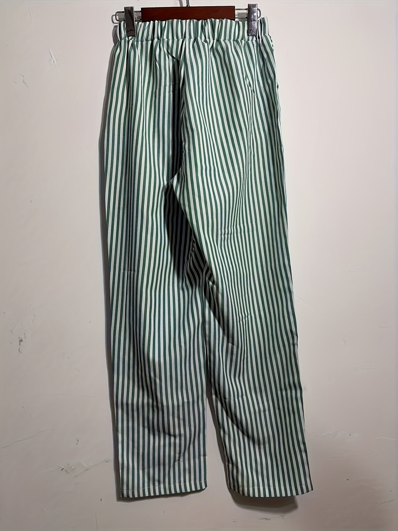 High-waisted, striped wide-leg pants for women made of lightweight polyester. Machine washable with side stripe detail for all-season comfort.