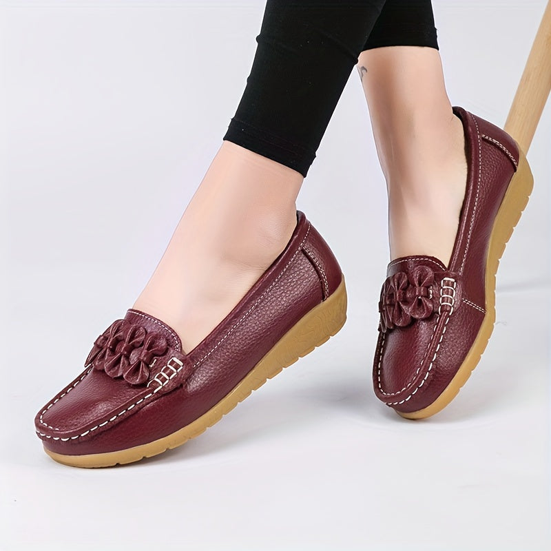 Women's flat shoes with bow detail, solid color, round toe, slip-on design for casual walking.