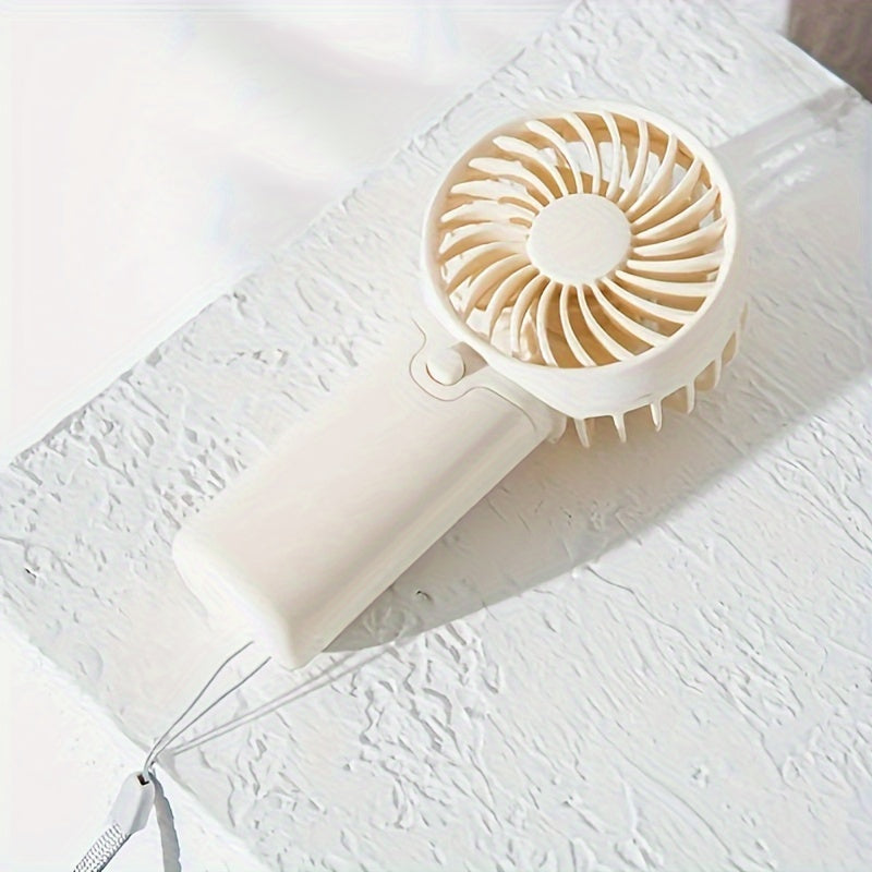 Portable Mini Fan - Lightweight and Battery-Powered Handheld Fan for Outdoor and Travel Use; AAA Batteries Sold Separately