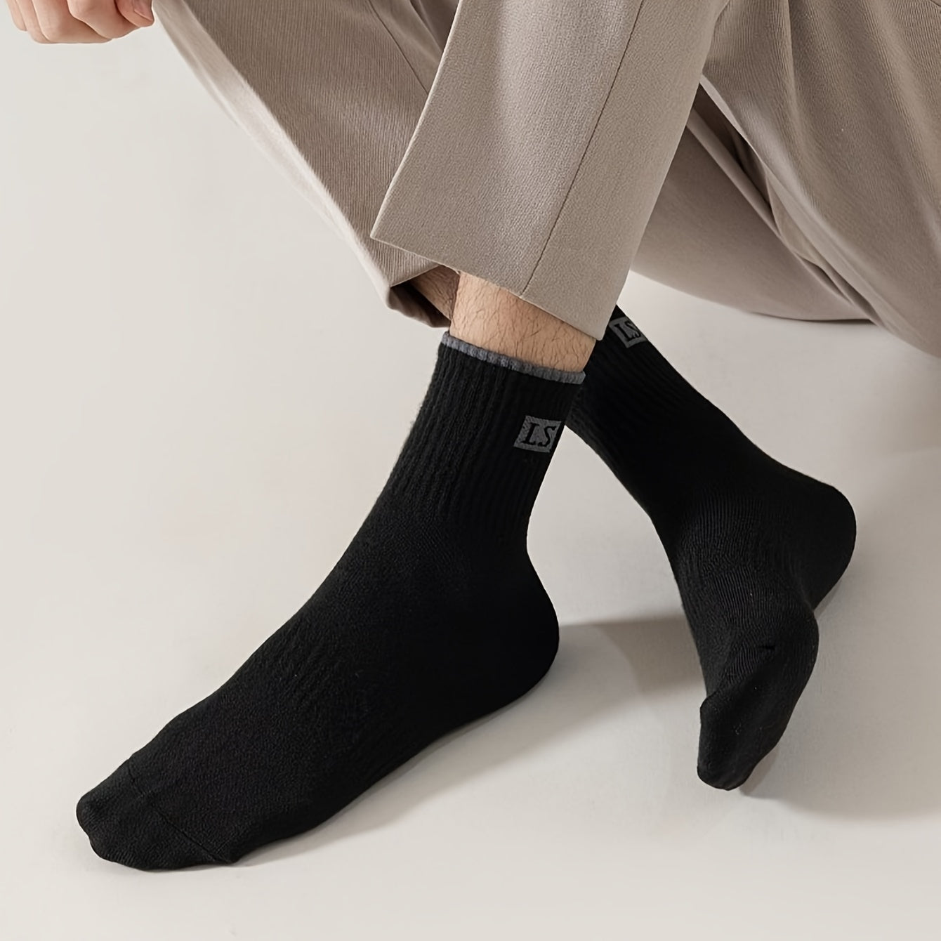 5 pairs of men's trendy solid crew socks, breathable and comfy for outdoor and all-season wear.