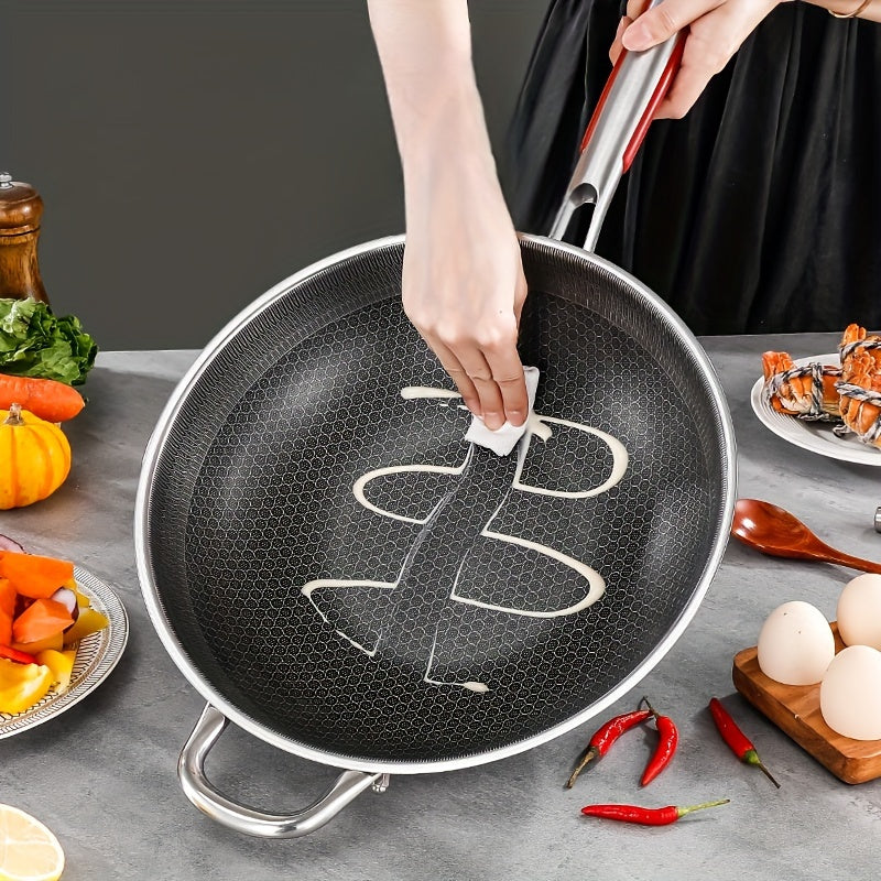 This durable stainless steel wok features a non-stick honeycomb pattern, perfect for home cooking. It is suitable for both electric and gas stoves, making it ideal for frying fish, eggs, and steaks. The round frying pan comes with a handle and a glass