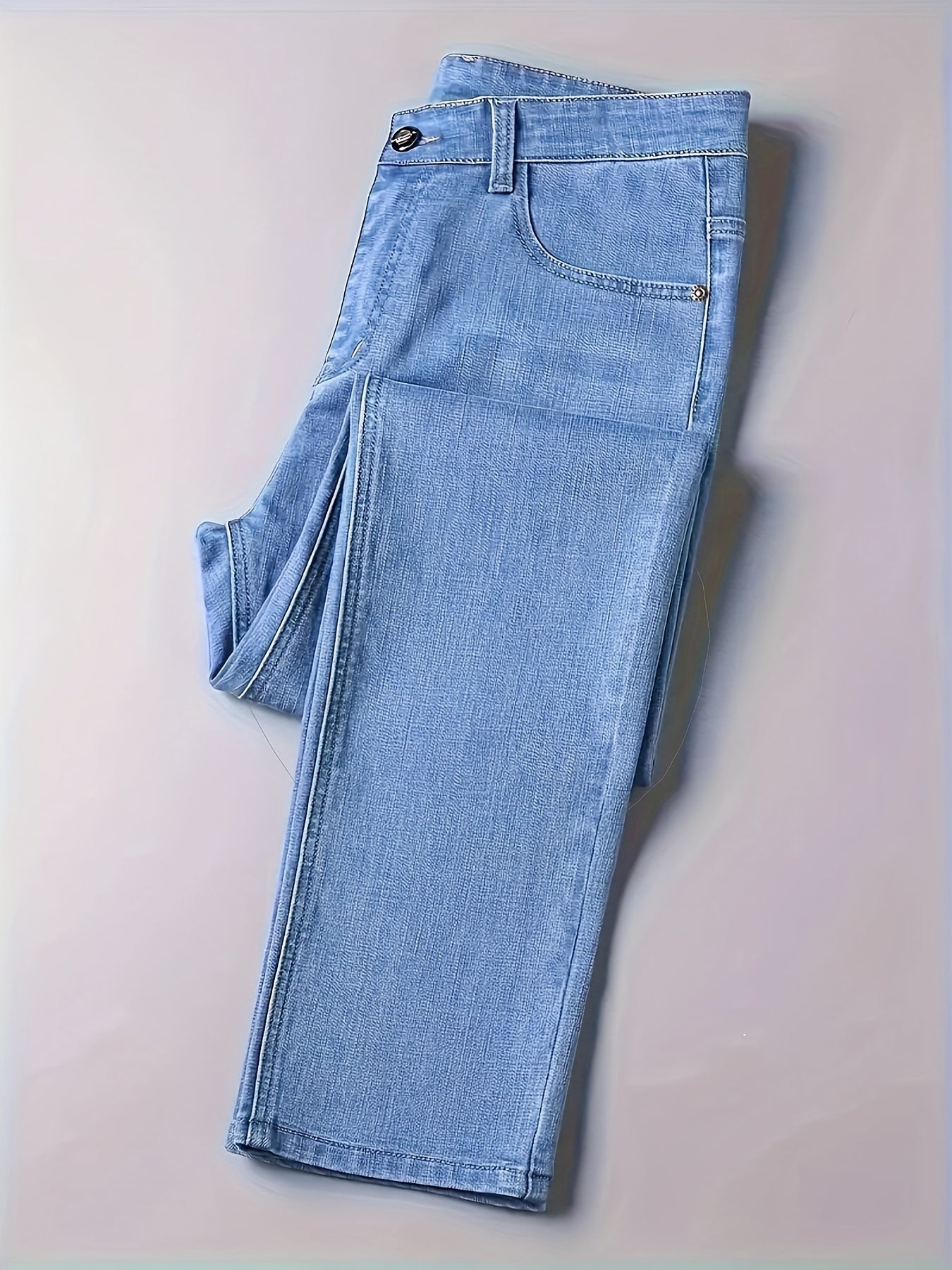 Casual solid denim pants for men with pockets, made from a cotton blend for outdoor activities.