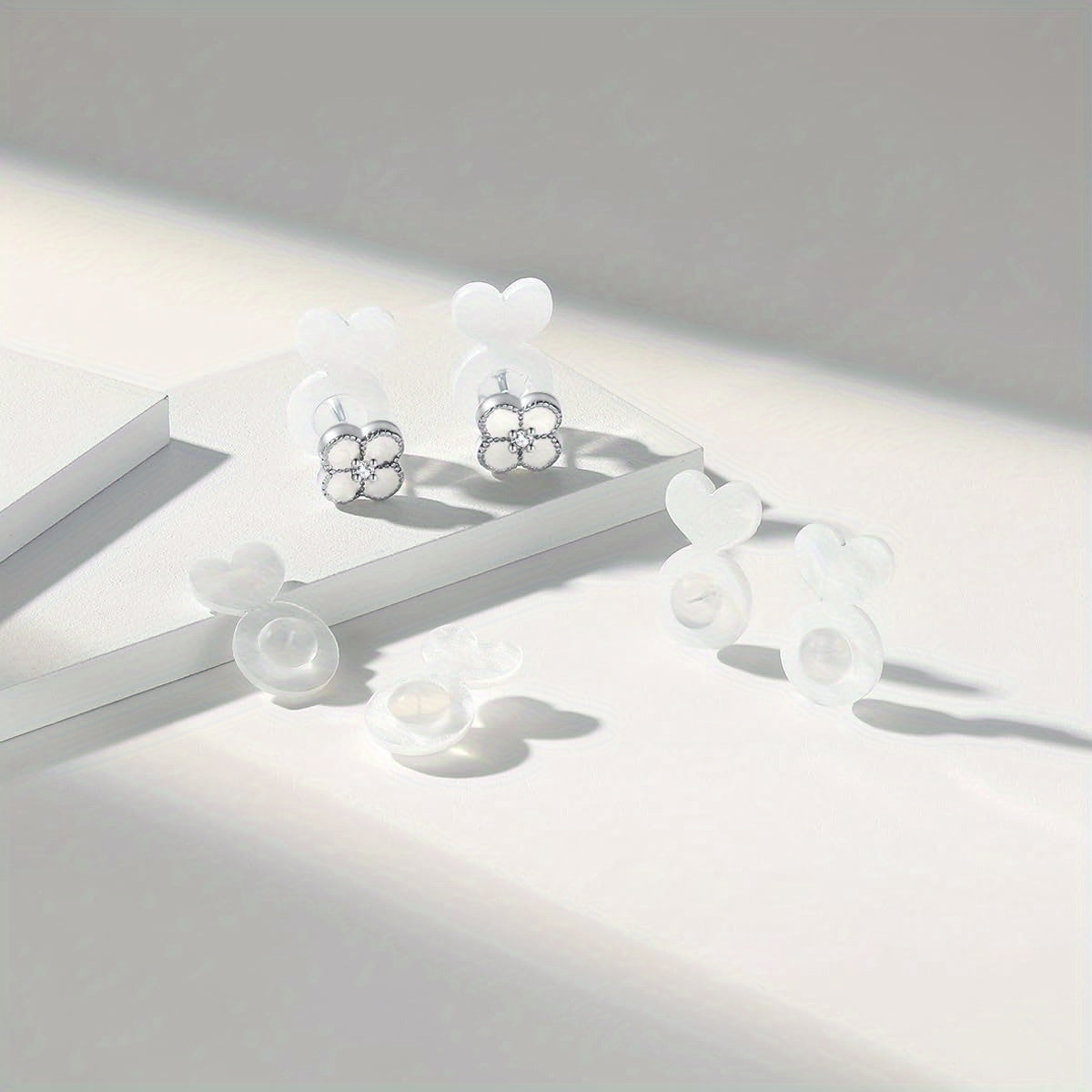 Silicone ear post backs provide invisible support for heavy earrings, preventing earlobes from drooping. This safe solution is ideal for studs and pendants.