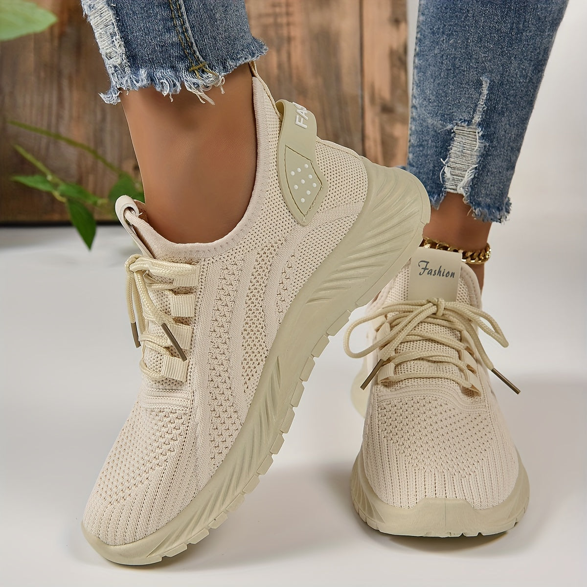 Trendy white knit fabric sneakers for women with EVA sole and breathable lace-up design, suitable for all seasons. Lightweight and stylish.