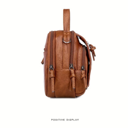 Unisex brown PU crossbody bag with zipper.