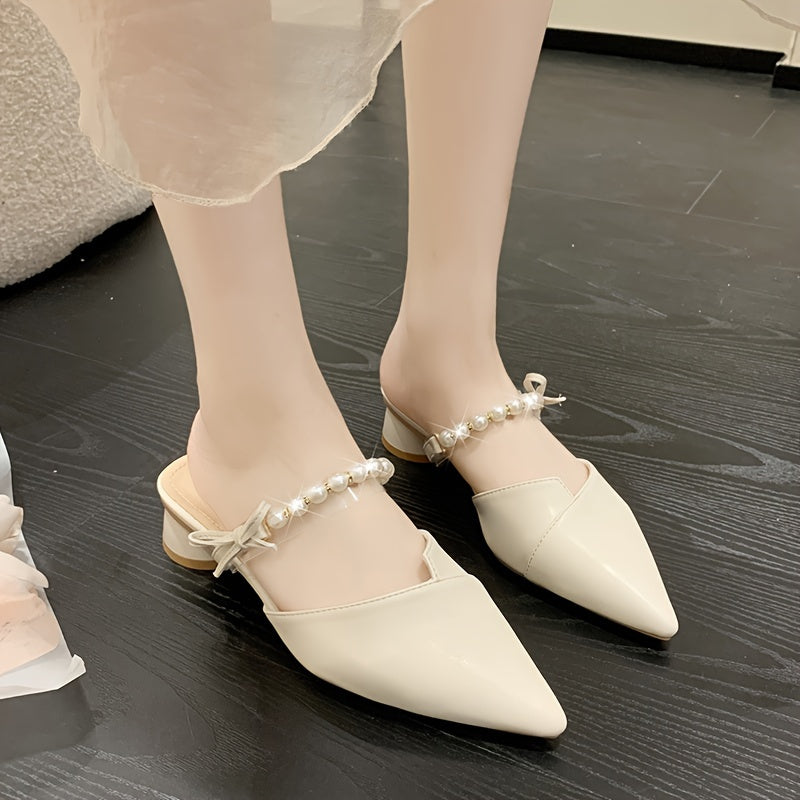 Stylish French-inspired mules for women, featuring a faux pearl ankle strap and chunky heel, perfect for outdoor wear in Summer 2024.