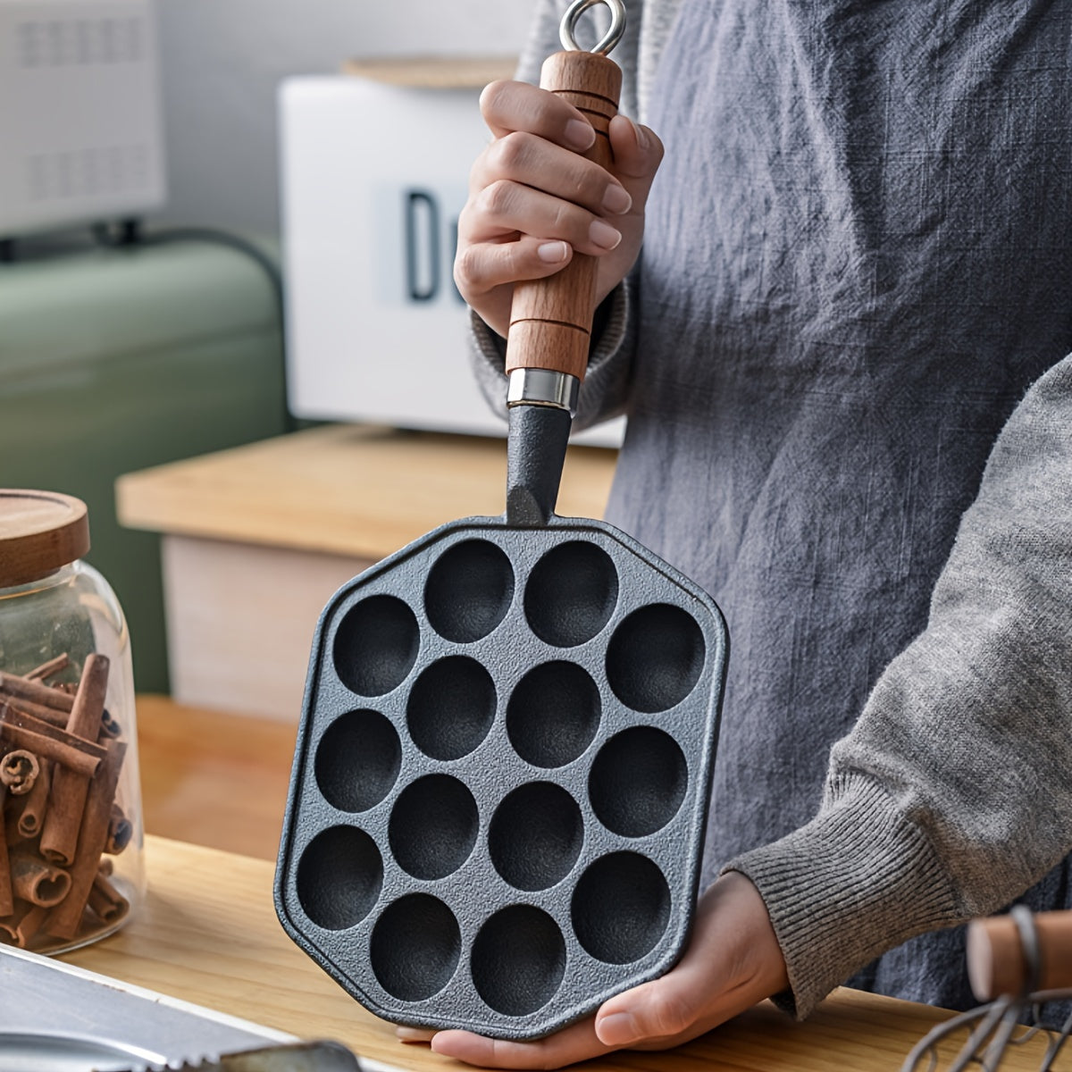 Get perfect takoyaki and poffertjes with our durable cast iron pan! This non-stick octopus ball maker and quail egg mold comes with a sturdy handle for easy use. Remember to hand wash only for best results - ideal for authentic Japanese and Dutch