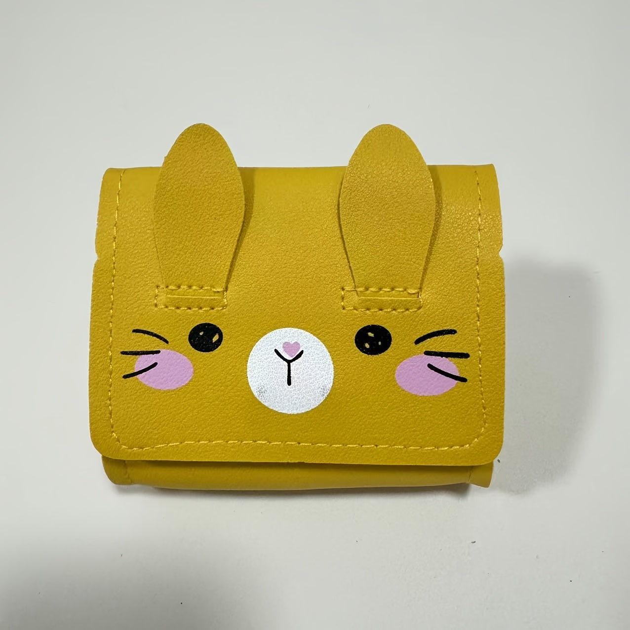 Cute bunny-themed mini crossbody bags in faux leather with adjustable strap. Includes cartoon coin purse and shoulder handbag in various colors. Bunny accessories available.