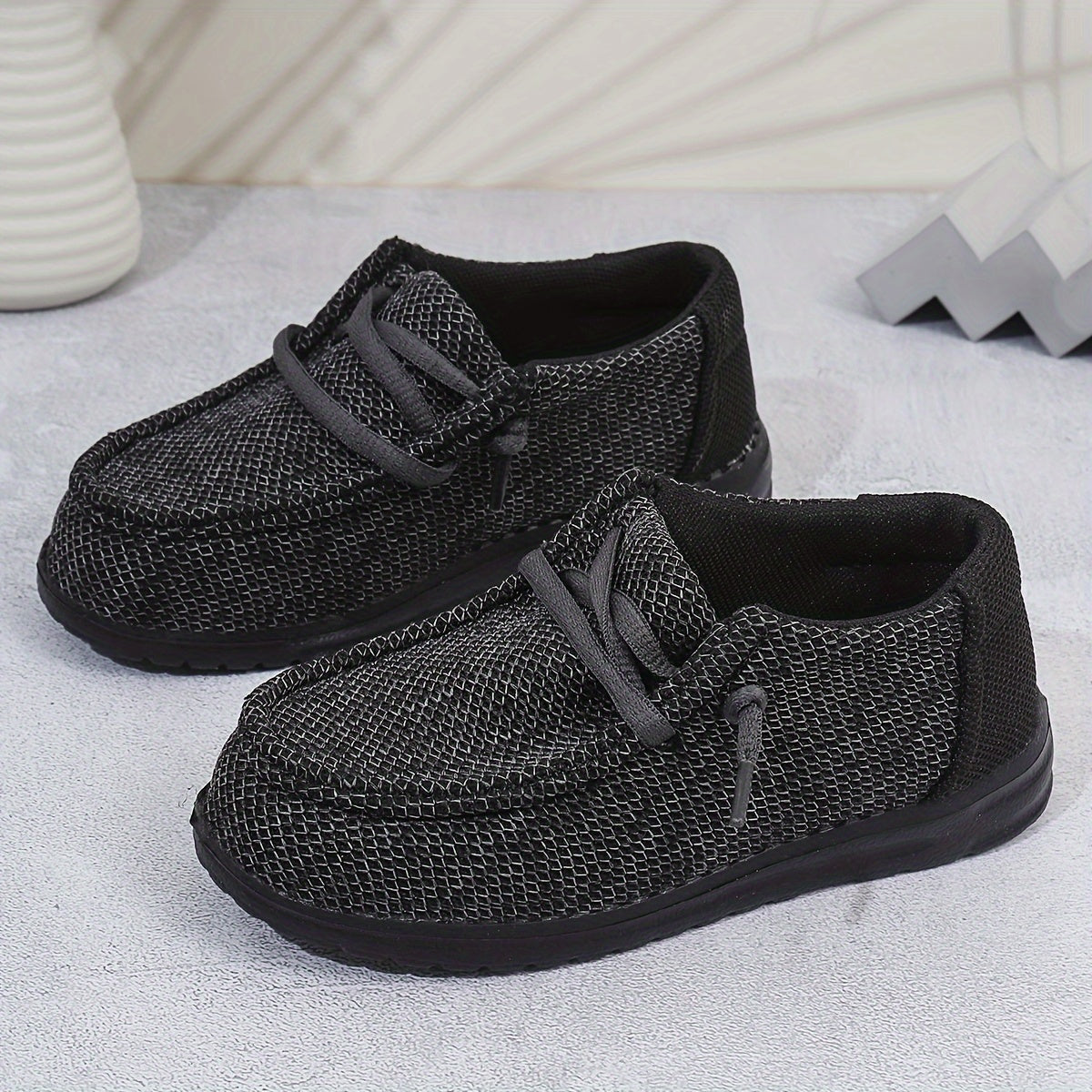 Vintage-inspired slip-on canvas shoes for boys with cushioned sole, perfect for all seasons.