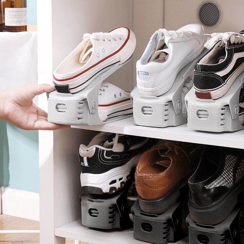 Space-saving double-layer shoe rack with adjustable and foldable design, suitable for flats, high heels, and sneakers. Perfect for dorms and home storage, available in gray/black. Ideal for storing flat shoes and sports shoes.