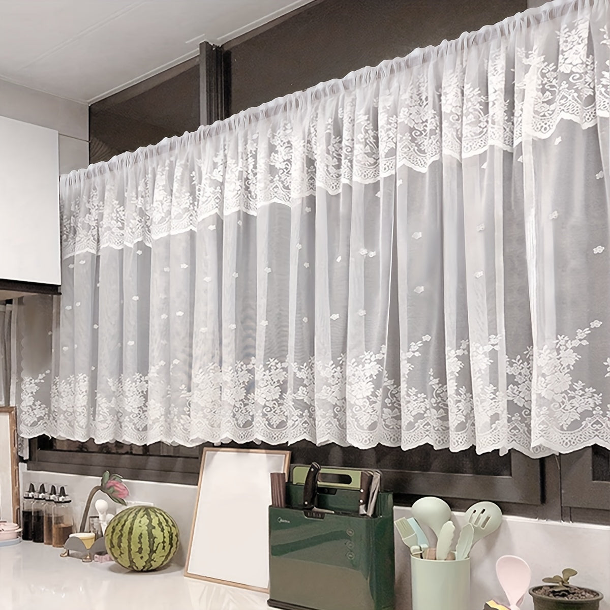 Add a touch of charm to your living space with this lovely White Floral Lace Curtain featuring a Sweet Garden Style. The Rod Pocket Design makes hanging a breeze, making it perfect for windows and doors in the living room, bedroom, or kitchen. Made of