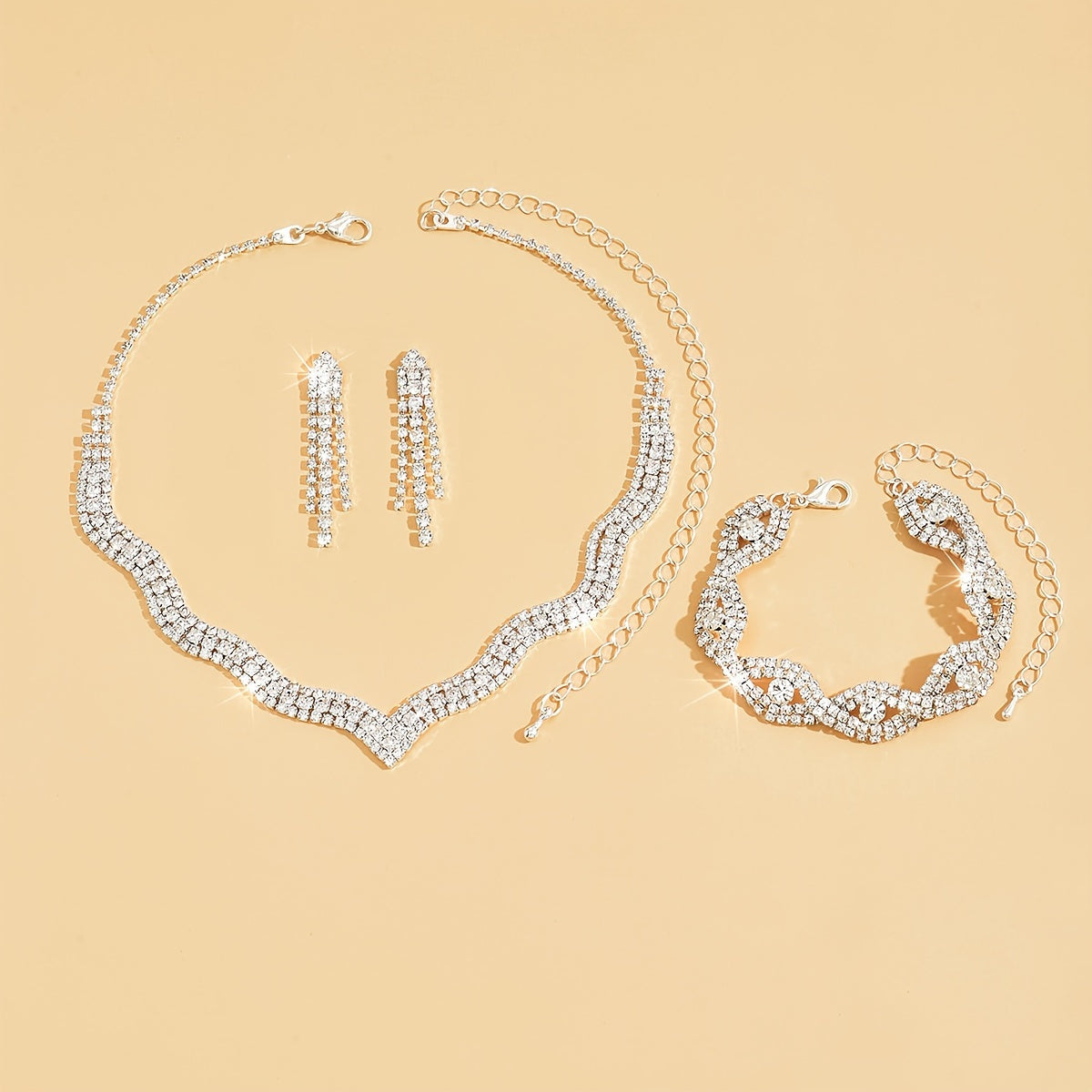 This elegant white jewelry set includes a stunning necklace, a pair of exquisite earrings, and a delicate bracelet, making it the perfect accessory for wedding parties and bridal gowns.