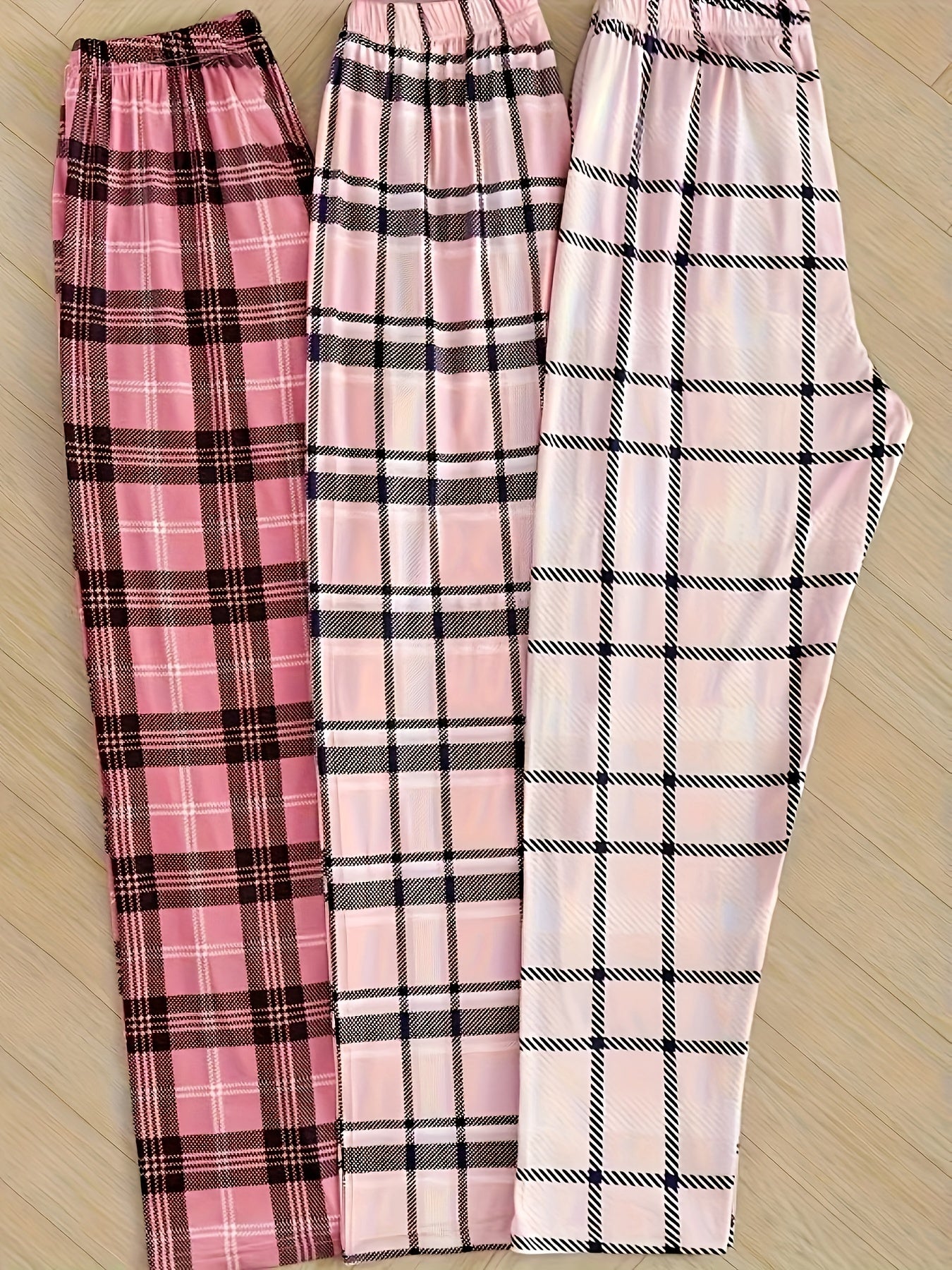 Women's plaid sleepwear pants set in pink and white checkered pattern for summer 2024. Includes elastic waistband for all-season comfort. Machine washable pajama set.