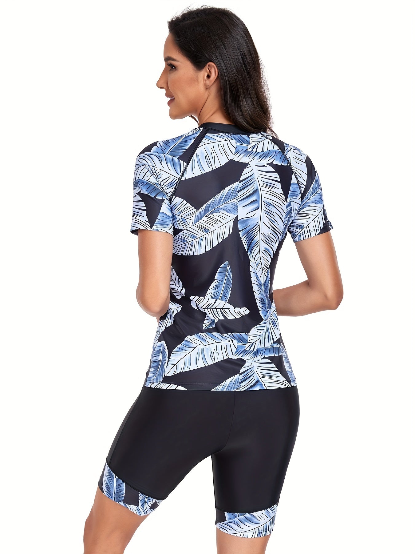 Two-piece swimsuits with leaf print, short sleeves, half zipper boxer shorts, and round neck, designed for competitive swimming.