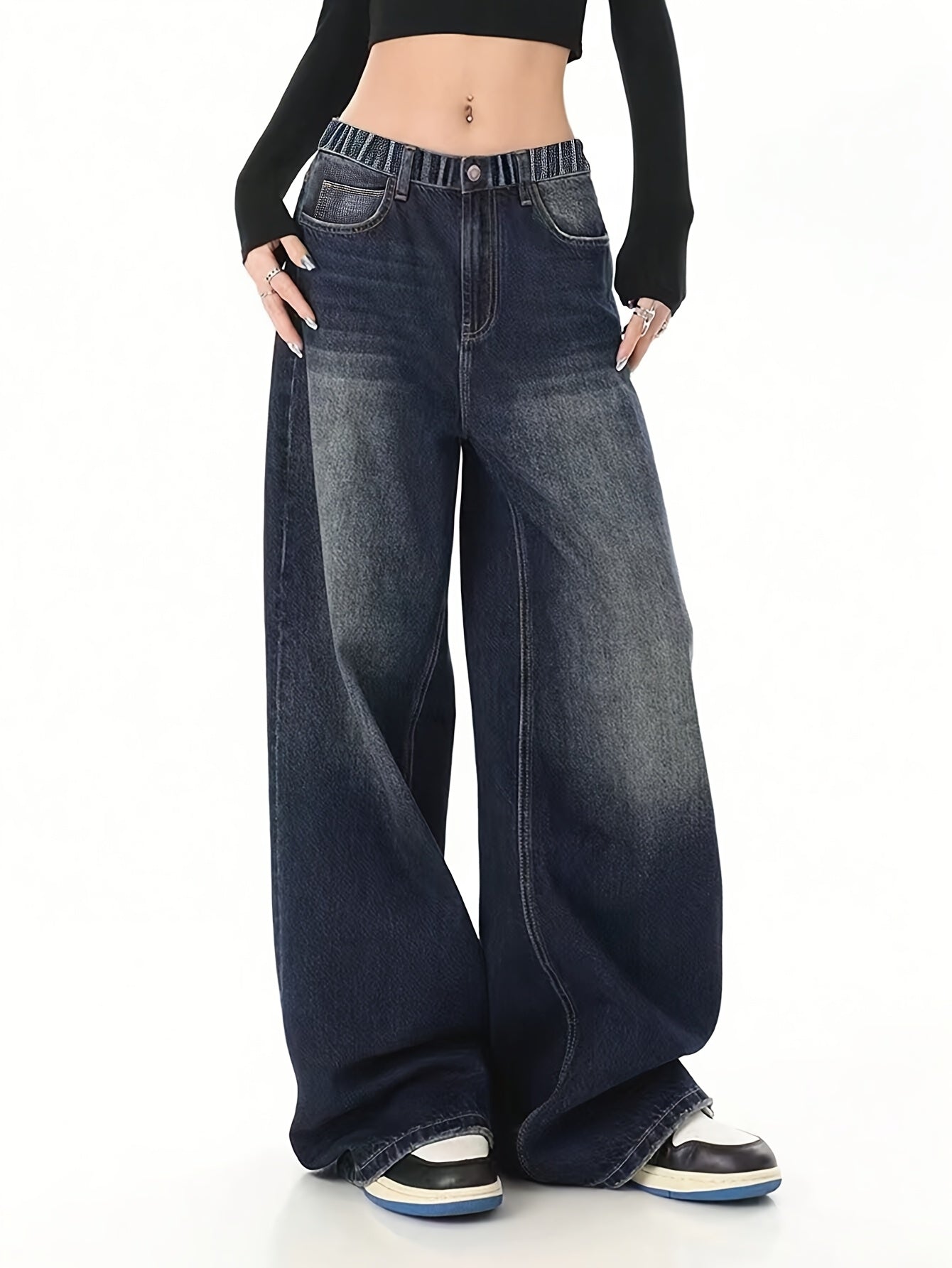 Youth wide-leg denim jeans with side pockets, elastic waist, and solid color. Non-stretch fabric suitable for all seasons.