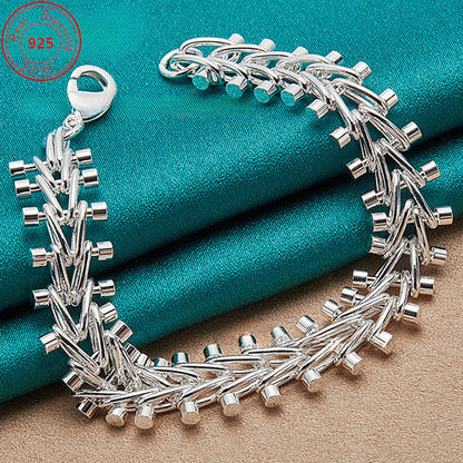 This bracelet is made of high-quality S925 sterling silver featuring a double bead chain design. It is beautifully crafted with exquisite silver detailing, embodying a fashionable retro style. This versatile piece is perfect for everyday wear or special