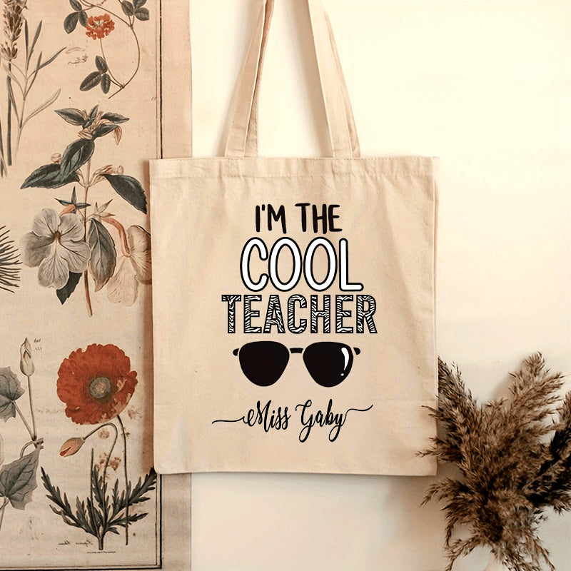 Customized Teacher Shoulder Bag with "I'm The Cool Teacher" Pattern, featuring a personalized name. This stylish canvas shopping bag is perfect for female teachers and makes a great gift for any teacher who loves aesthetic school bags.