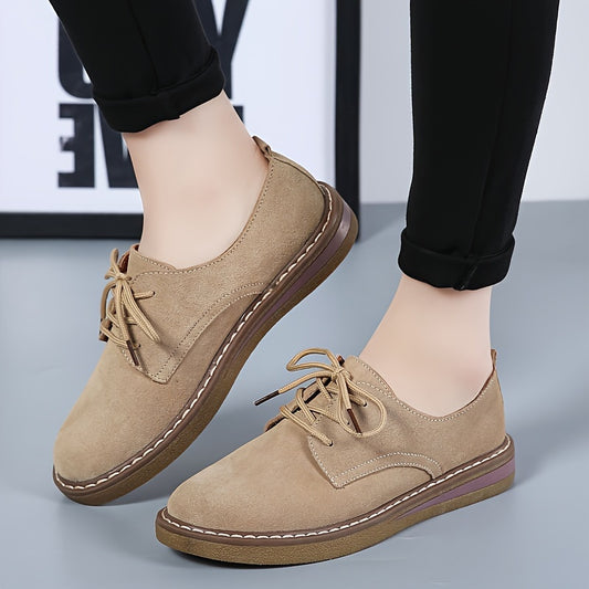 Solid color flat loafers with lace-up design, comfortable for women.