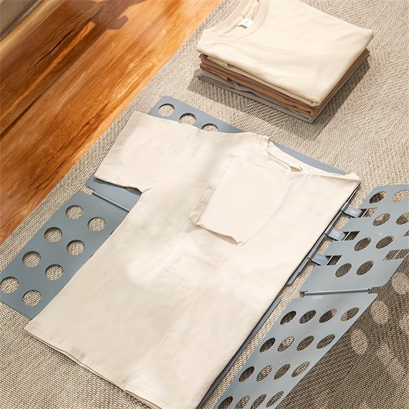 Get organized with our durable plastic Space-Saving Clothes Folding Board. This adjustable board is perfect for folding t-shirts and more, making it ideal for travel or home organization. It helps maximize closet space and can be easily stored when not