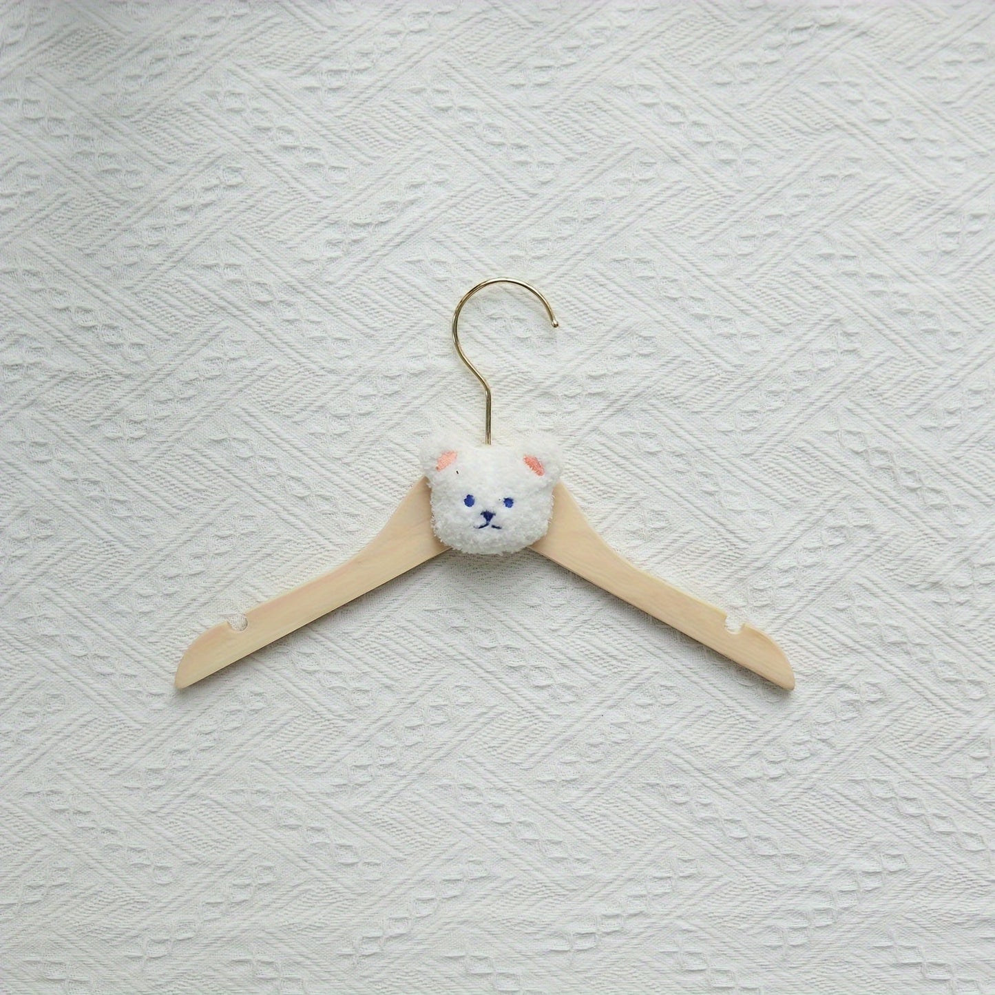 Durable and Lightweight Wooden Clothes Hangers featuring a Nordic Style Cartoon Bear Design, with Swivel Hooks for easy maneuvering. Recommended for Ages 14 and up.