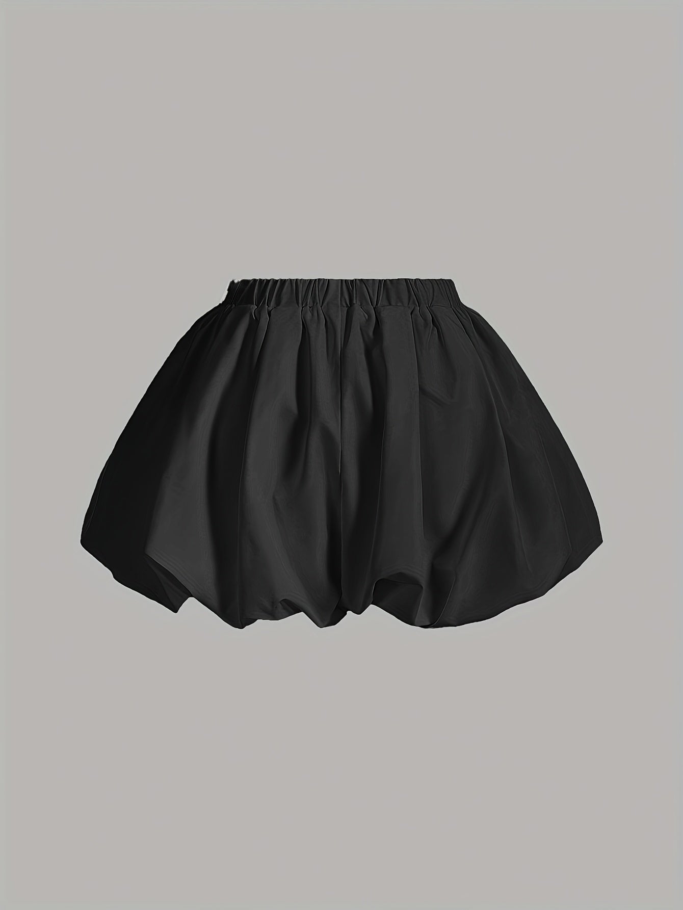 Double-layer high-waisted shorts with lining and lantern shape in solid color.