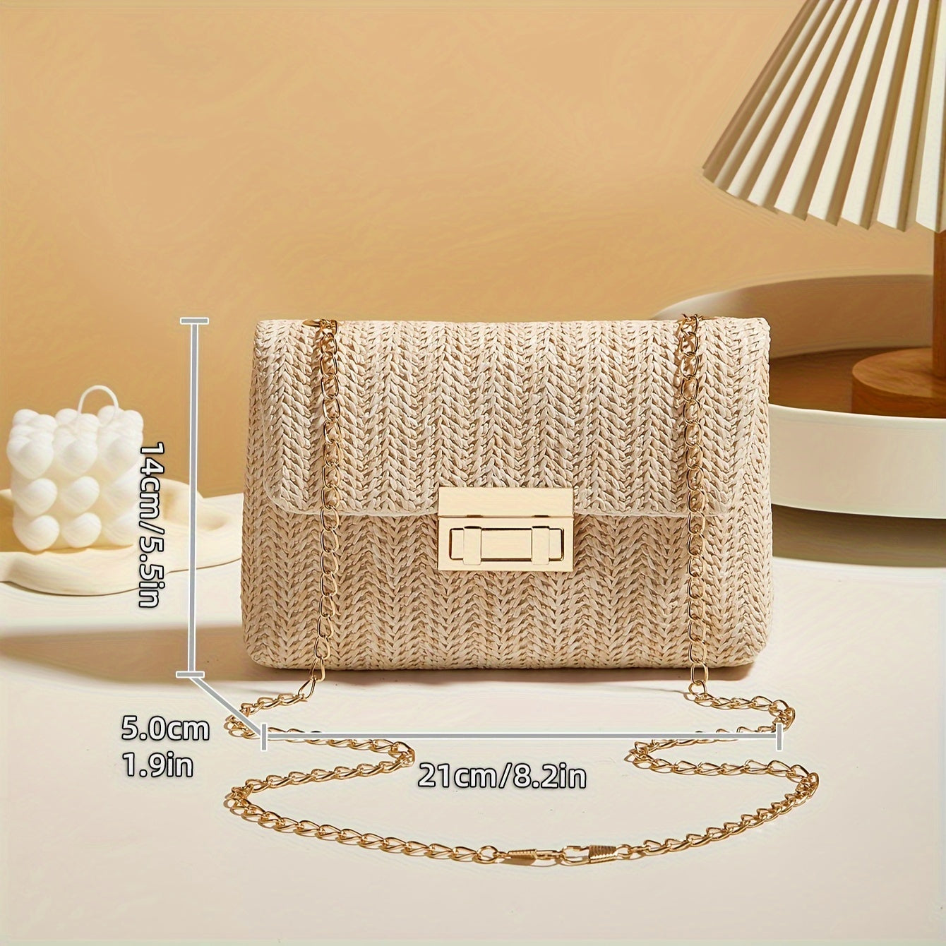 Handmade woven shoulder bag for ladies with chain strap and lock buckle, suitable for crossbody wearing.