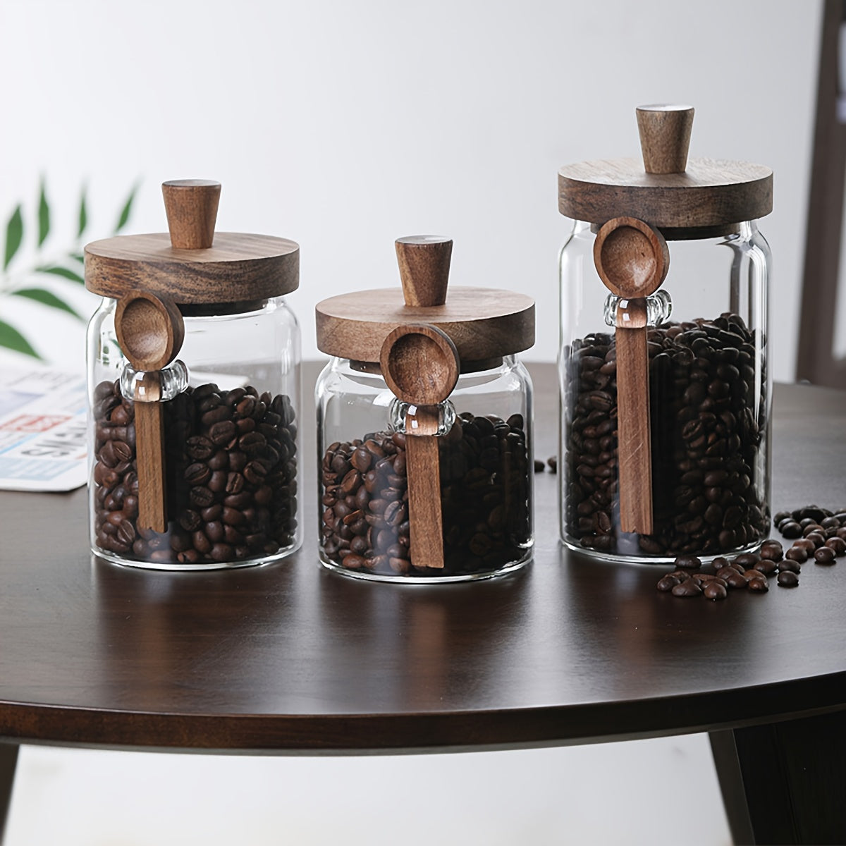 Glass containers for storing coffee, tea, grains, snacks, and pickles.