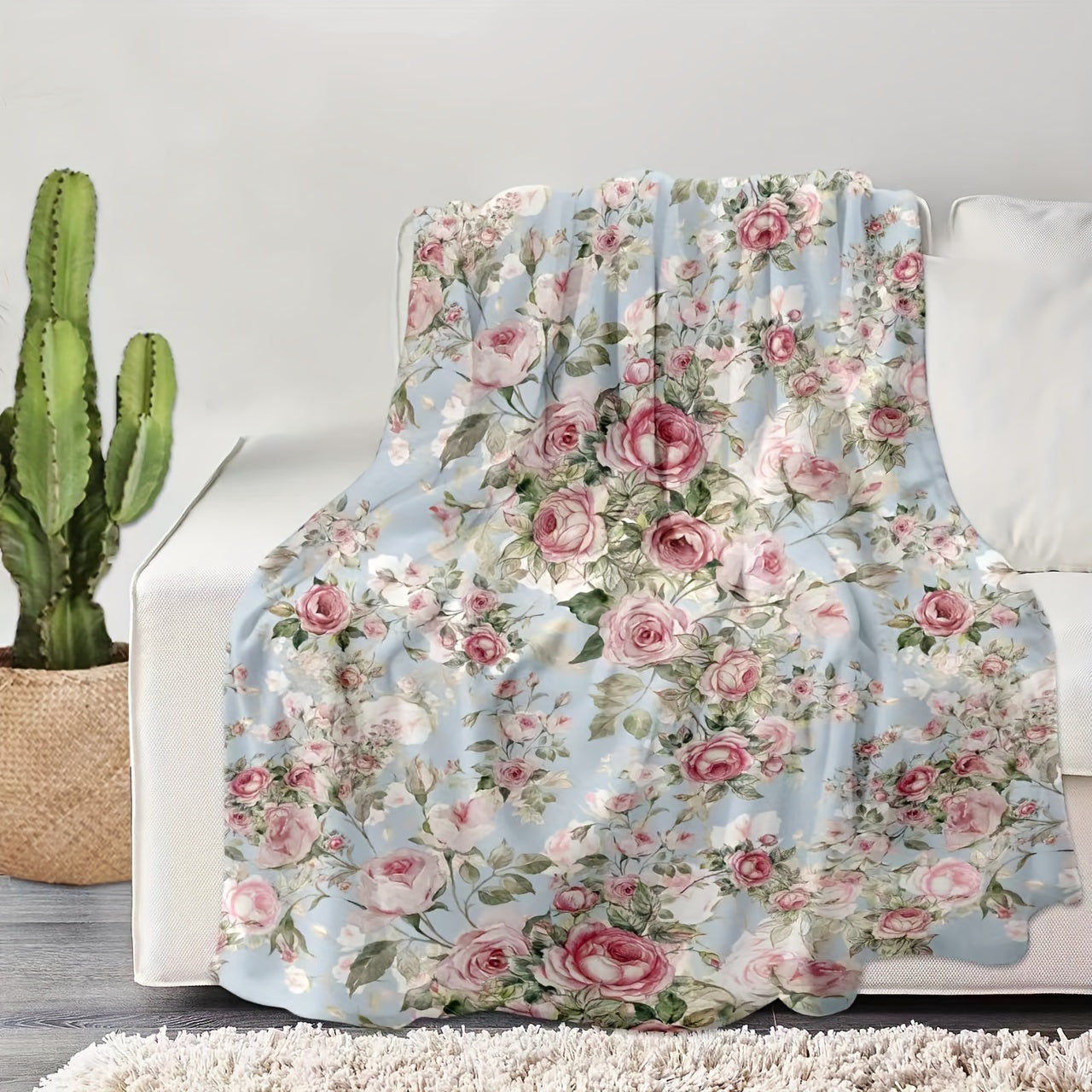 Soft and cozy flannel blanket featuring a beautiful floral rose print, perfect for using on the couch, sofa, in the office, on the bed, while camping, or during travel.