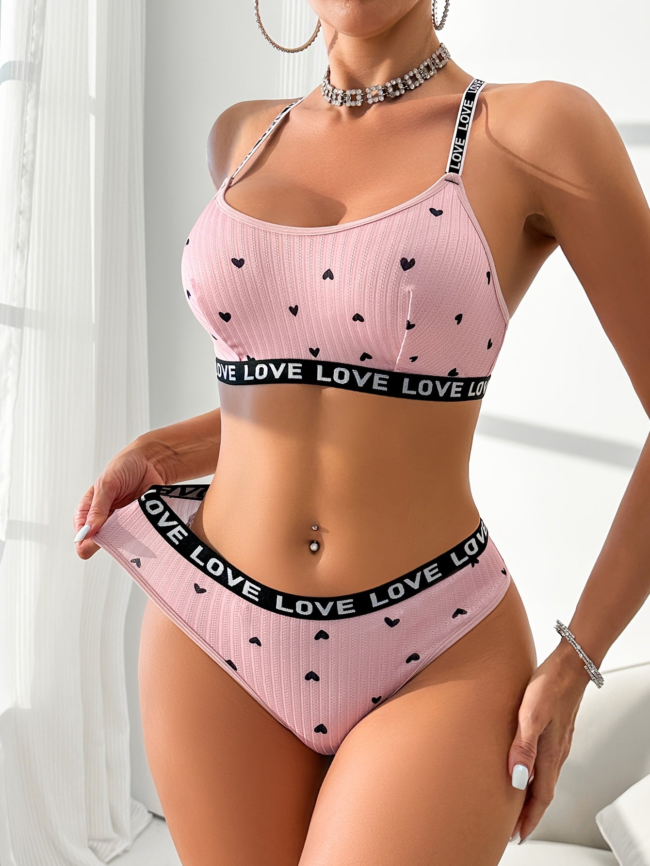 Women's sexy heart print lingerie set made from polyester knit fabric with LOVE strap detail, braid accent. Adult intimate apparel.