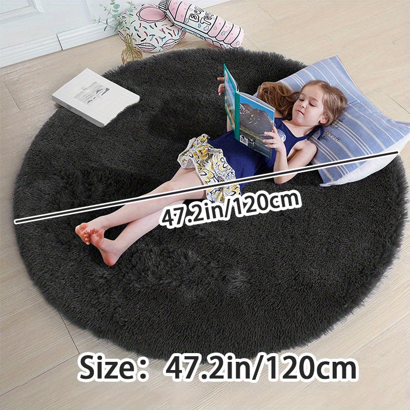 Soft shaggy round rug made of 100% grey polyester. This fluffy area rug is machine washable, fade resistant, and features a low pile tufted weave with PVC backing. Perfect for bedroom, nursery, and kids room decor. Great for gifts on Christmas