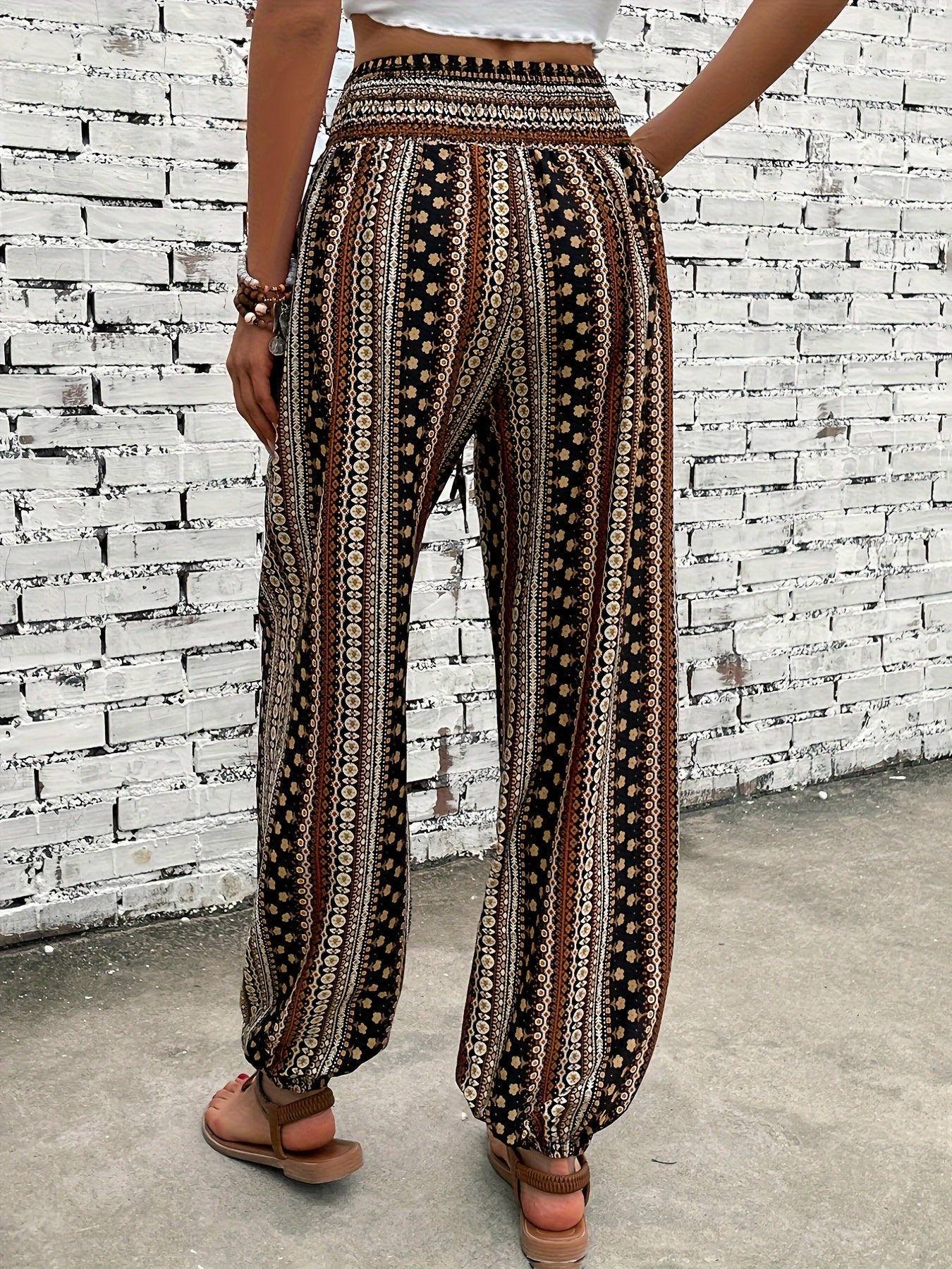 Ethnic style printed pants for women with pocket, button, and elastic waist in plus-size.