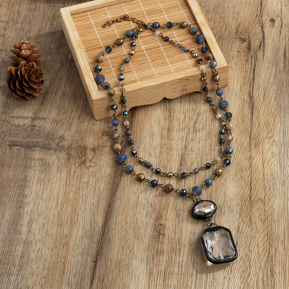 New tribal style necklace featuring two layers of natural stone crystals and glass chains, with a square glass pendant designed for daily wear by both men and women during the spring and summer seasons.