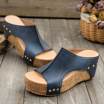 Women's stylish wedge sandals with metallic buckle straps in black, navy blue, and brownish-gold tones. Comfortable and fashionable.