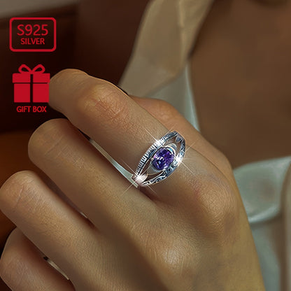 Beautiful and mysterious sterling silver ring with purple waterish zirconia inlay, symbolizing beauty and mystery. This high-quality adjustable ring is perfect for any occasion.