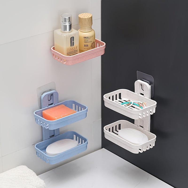 Wall-mounted soap holder with box drain for toiletries and shampoo.