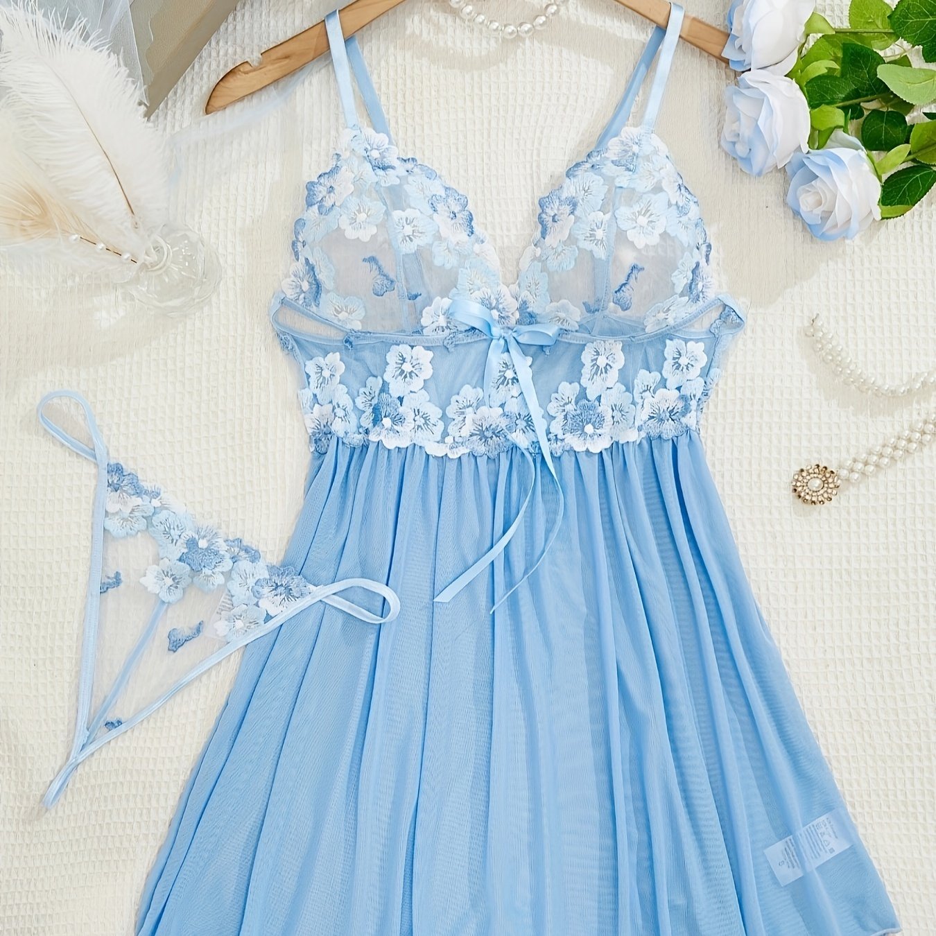 Women's sexy clothing set includes embroidered flower pattern babydoll, deep V slip dress, and thong.