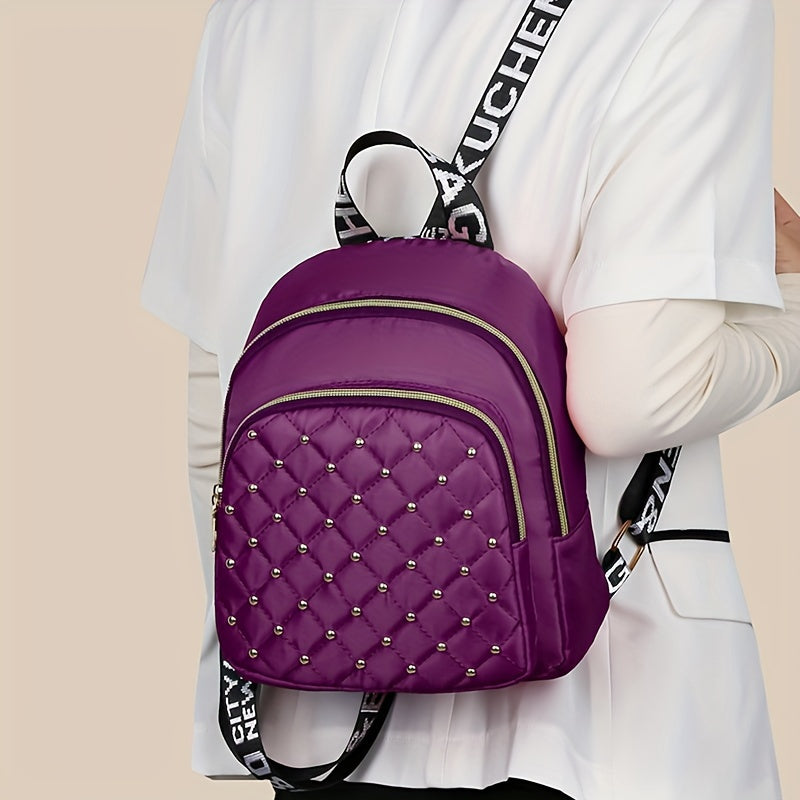 Stylish nylon backpack with rhinestone embellishments, lightweight, tassel detail, adjustable straps, and polyester lining. Suitable for daily commute or fashionable travel for women 15