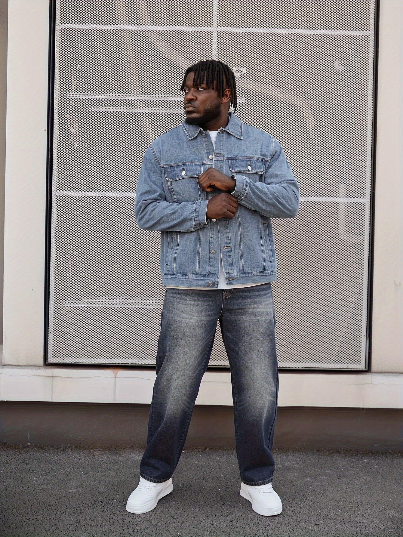 Plus size men's washed denim jacket with classic fit made from cotton fabric.