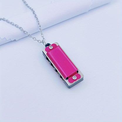 Necklace harmonica with four holes and eight tones for playing songs.