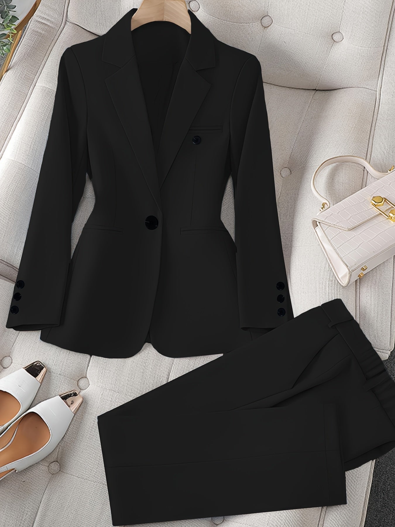 Women's casual 2-piece set with long sleeve blazer and pants in solid black color. Made of 100% polyester with lapel collar and regular fit. Suitable for all seasons, made of woven fabric