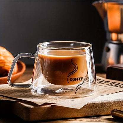 Double-walled glass coffee mug with cappuccino handle, heat-resistant, transparent, and reusable for home and kitchen.