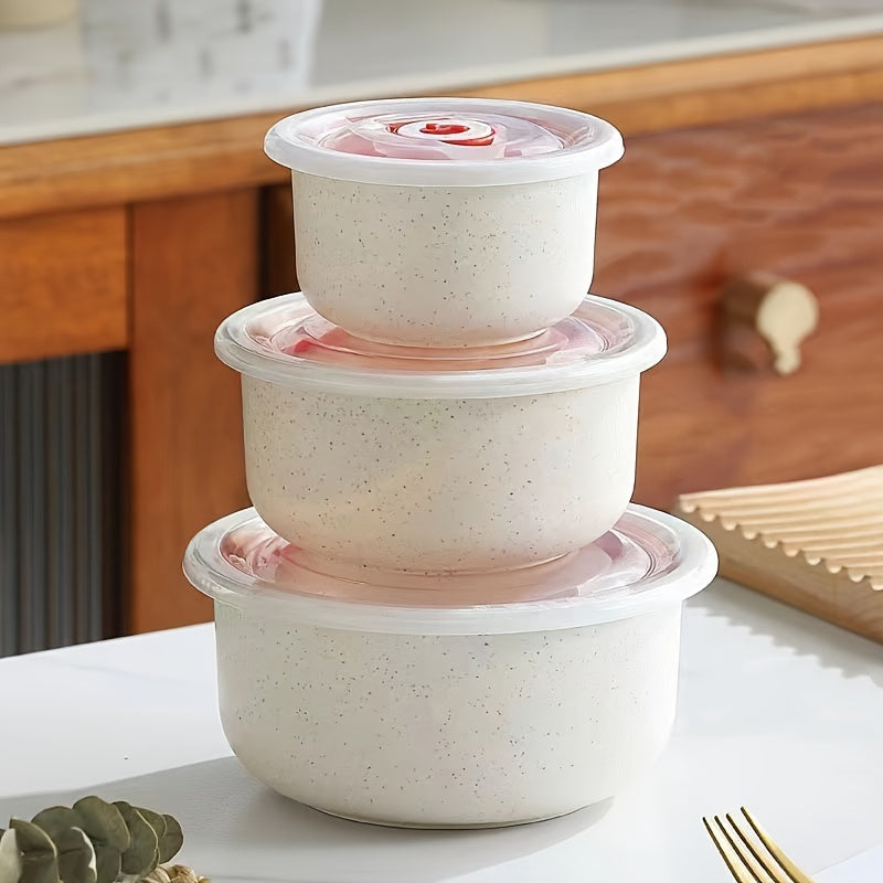 Set of three food storage containers made from wheat straw material, featuring flip top lids. Versatile, eco-friendly, hand wash recommended, microwave-safe, round bowls with sealable lids for preserving food.