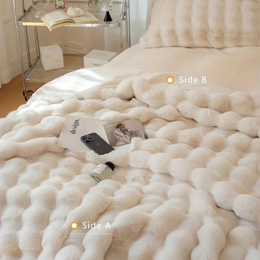 One piece of decorative soft and thick fuzzy faux rabbit fur throw blanket for couch or sofa. This reversible plush warm fleece blanket is perfect for winter, providing luxury and coziness. The cute and furry cream white blanket is also ideal for bed.