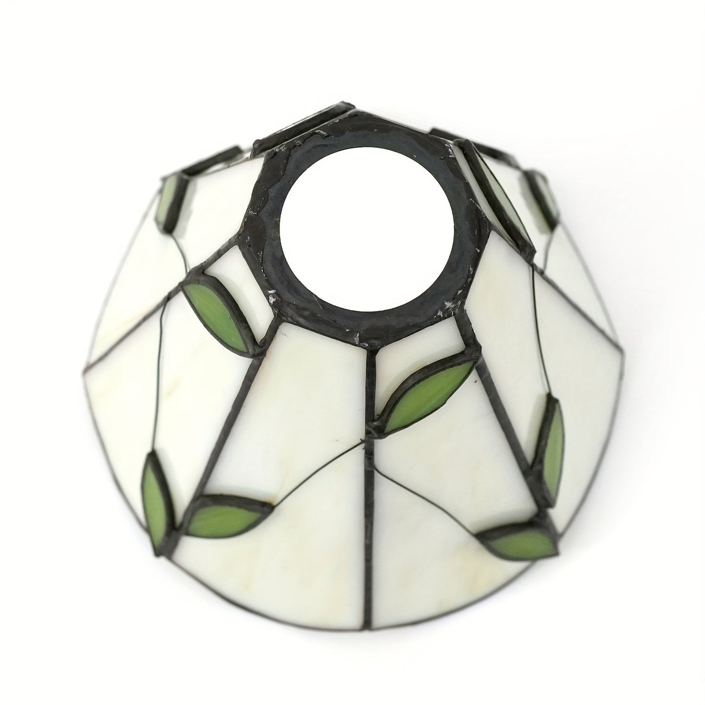 This 6-Inch Leaf Pattern Handcrafted Stained Glass Lamp Shade is an artisan crafted decorative piece perfect for pendant and wall lighting fixtures. Suitable for ages 14 and up, this lampshade does not include any battery or wireless features.