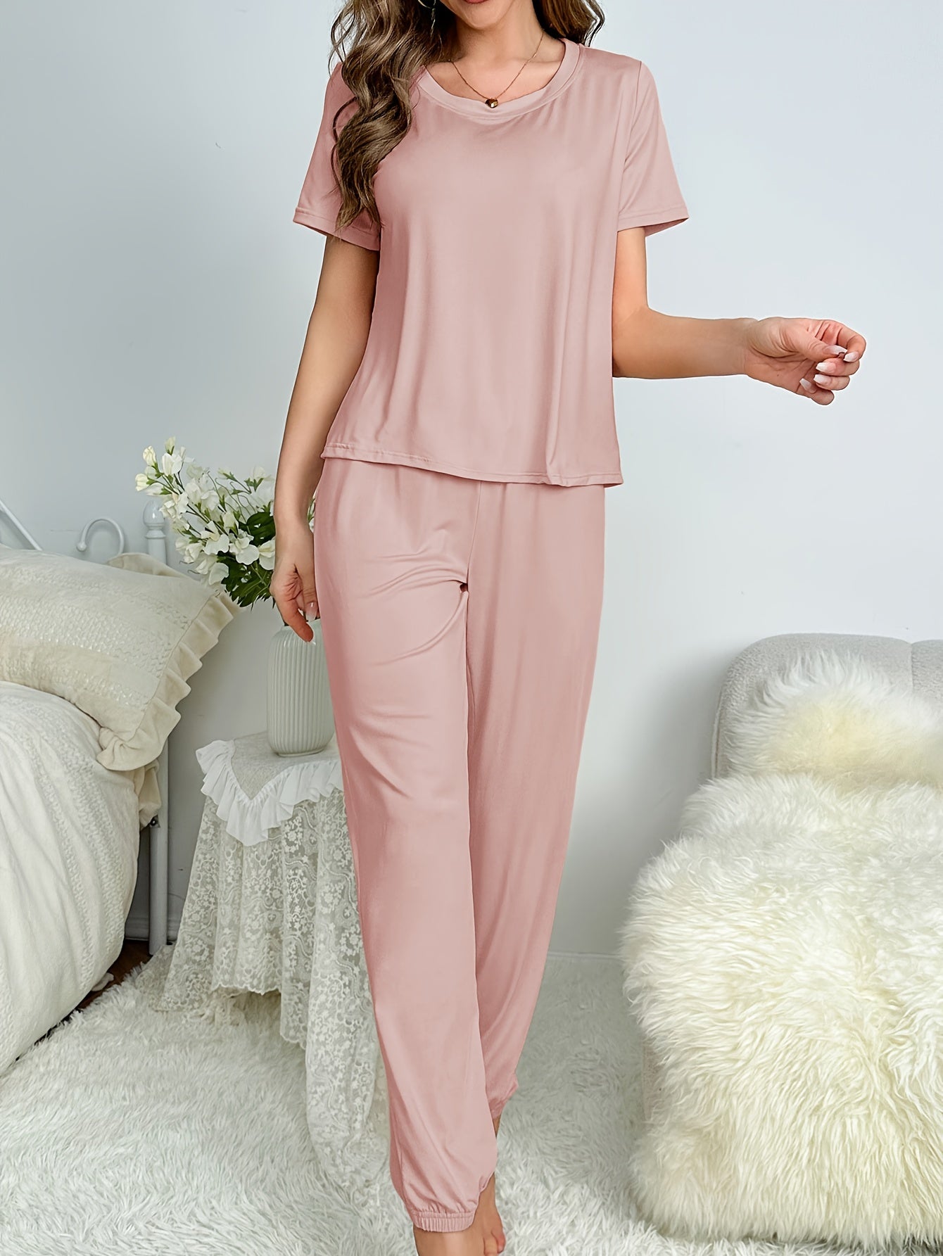 Cozy lounge set with short sleeve top and elastic drawstring pants for women's sleepwear.