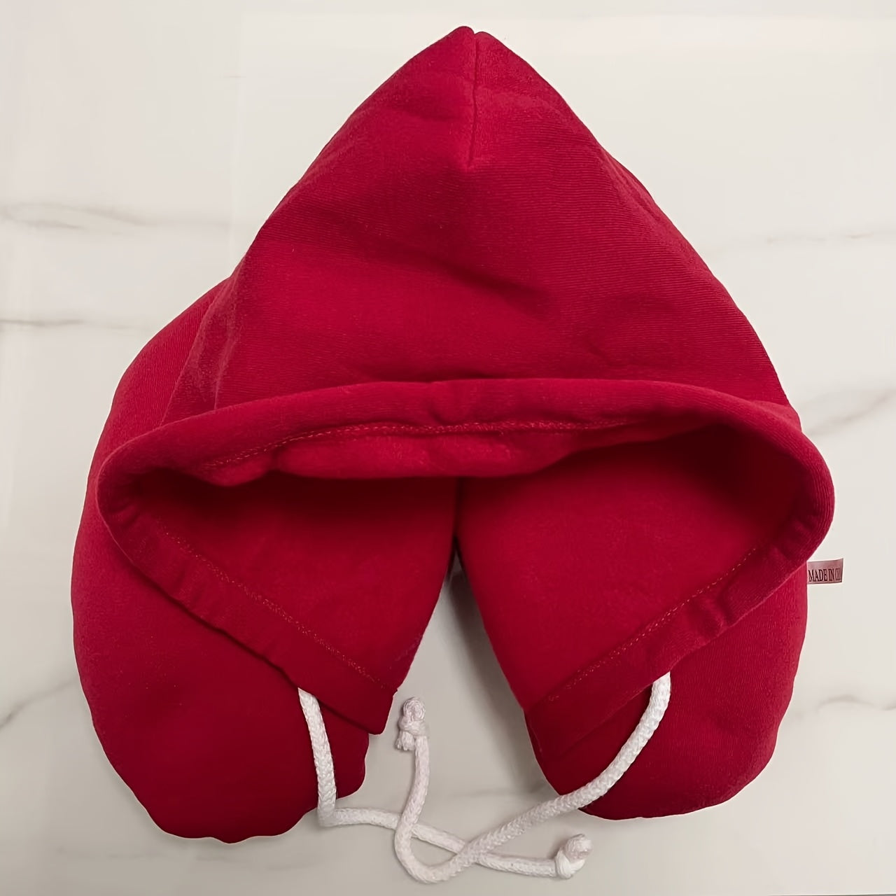 Travel in comfort with our Ergonomic U-Shaped Travel Pillow with Hoodie. This multipurpose neck support is adjustable for a cozy nap on airplanes, car trips, and bus journeys. Designed for adults 18 and older, it features a soft polyester filling and a