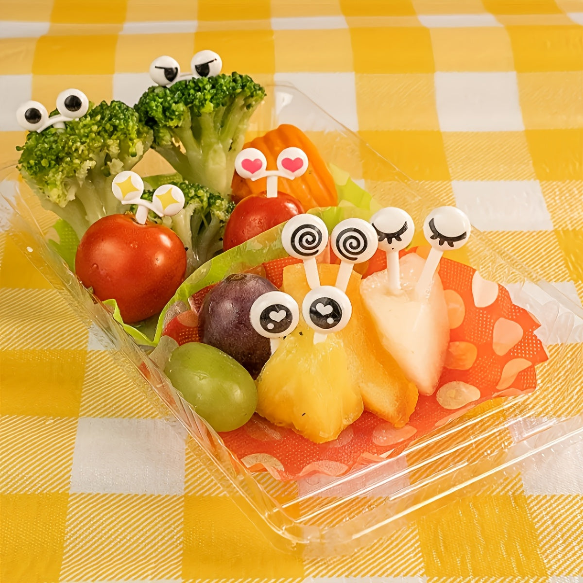 20 reusable mini eye-shaped food forks made of BPA-free ABS plastic in assorted designs for fruits, vegetables, and pastries, perfect for parties and casual dining.